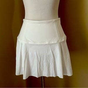New without tags. Lululemon white tennis mini skirt skort size 4